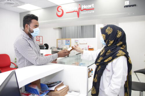 Pharmacist dealing with patient 